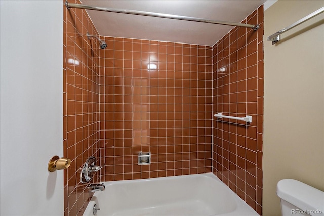 bathroom featuring toilet and bathing tub / shower combination