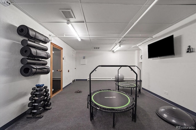 exercise room with baseboards