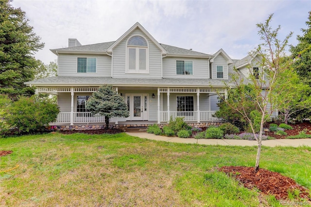 31 N Algonquian St, Aurora, CO 80018 - victorian-style house featuring a porch, a front yard, and a chimney