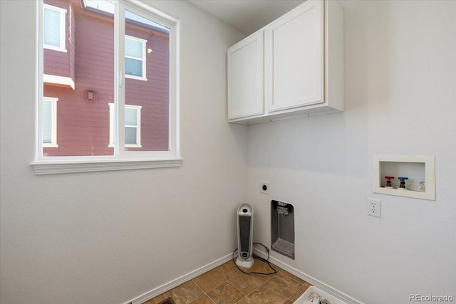 clothes washing area featuring tile patterned flooring, electric dryer hookup, cabinets, and hookup for a washing machine