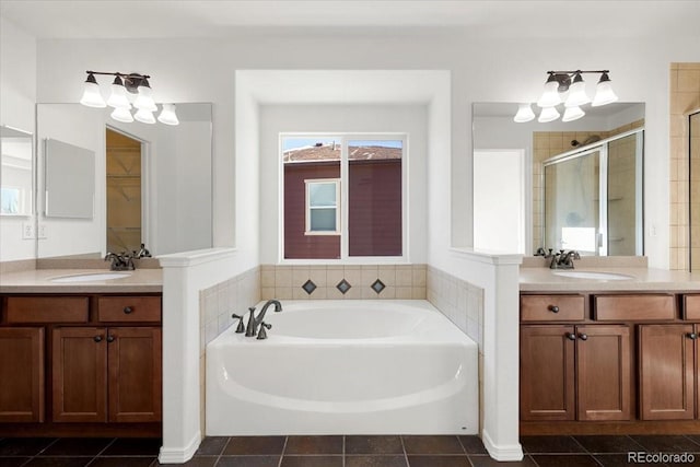 bathroom with tile patterned flooring, vanity, and independent shower and bath