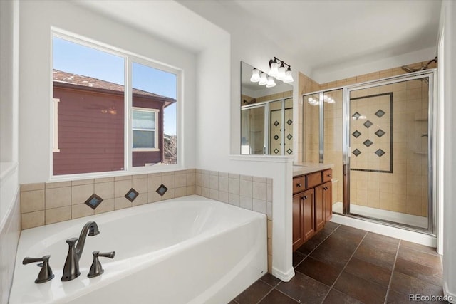 bathroom featuring plus walk in shower and vanity