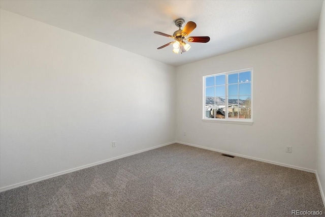 carpeted empty room with ceiling fan