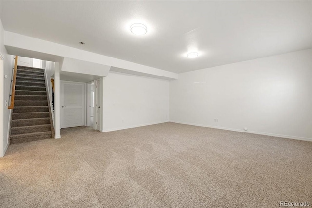 basement with light colored carpet