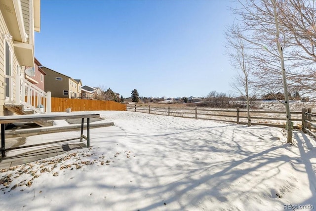 view of yard covered in snow