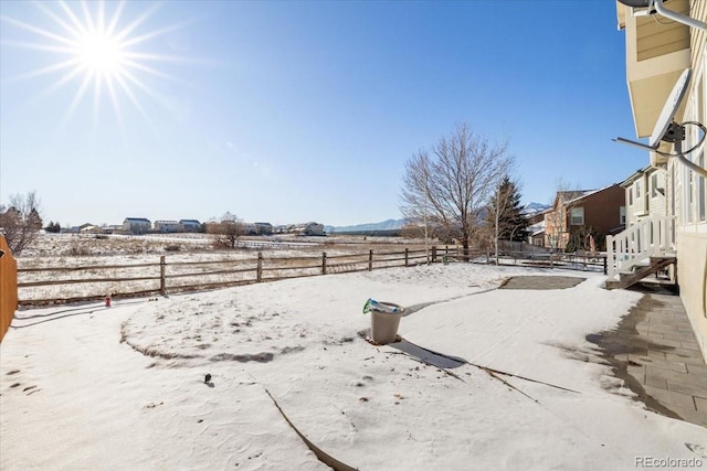 view of yard layered in snow