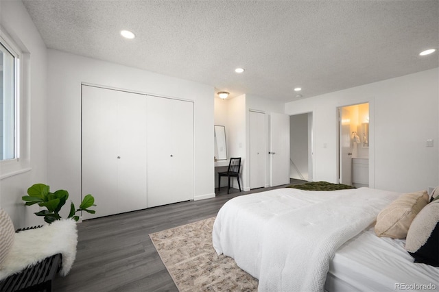 bedroom featuring dark wood finished floors, recessed lighting, a textured ceiling, and ensuite bathroom