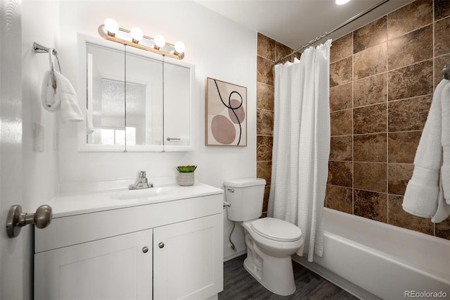 full bathroom with shower / tub combo, toilet, wood finished floors, and vanity