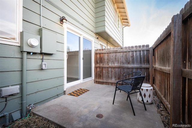 view of patio featuring cooling unit and a fenced backyard