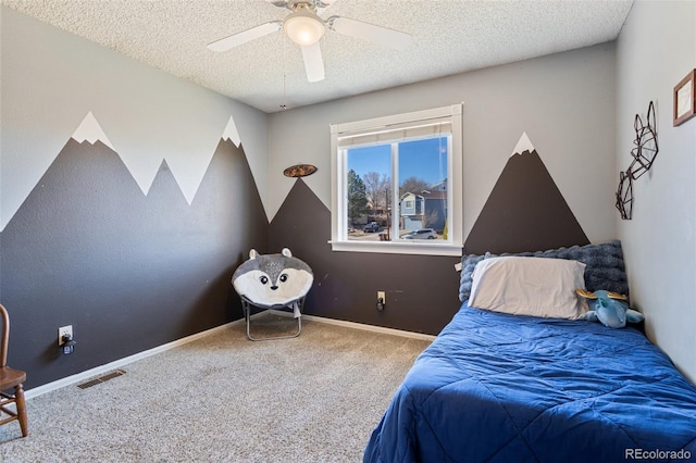 bedroom featuring visible vents, a textured ceiling, baseboards, and carpet floors