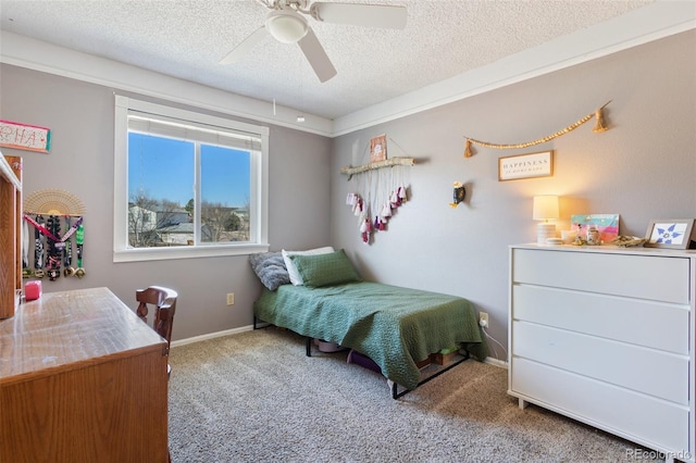 bedroom with baseboards, carpet, ceiling fan, and a textured ceiling