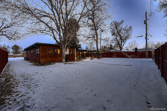 view of yard layered in snow