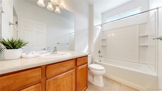 bathroom with toilet, vanity, shower / washtub combination, and tile patterned floors