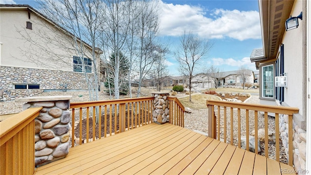 wooden terrace featuring a residential view