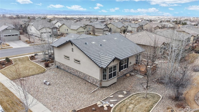 birds eye view of property with a residential view