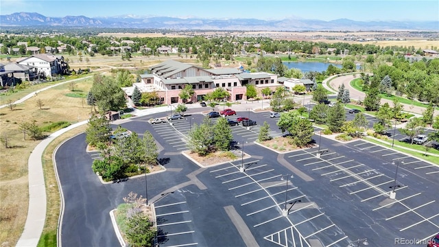 aerial view featuring a residential view and a water and mountain view