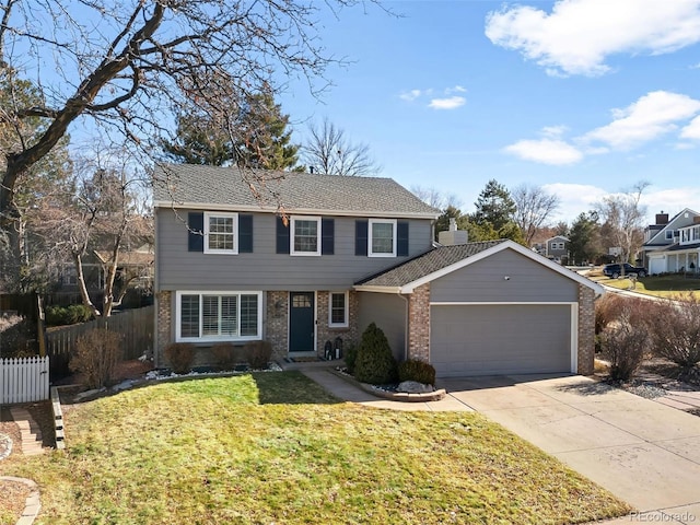 view of property featuring a garage and a front yard