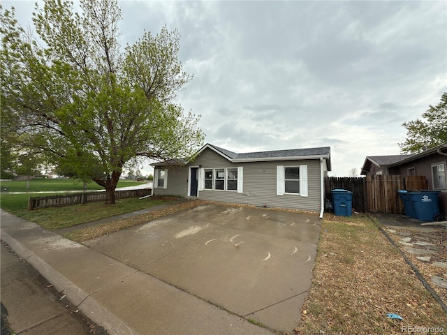 201 Valdai St, Brighton, CO 80603 - view of front of home featuring fence and driveway