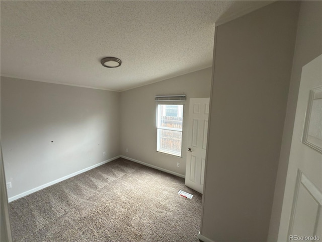 201 Valdai St, Brighton, CO 80603 - carpeted empty room with a textured ceiling, baseboards, and lofted ceiling