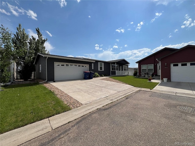 6100 Bluestem Unit 238, Frederick, CO 80530 - single story home featuring a front lawn, a garage, and driveway
