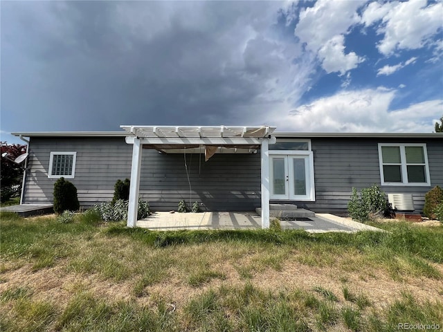 6100 Bluestem Unit 238, Frederick, CO 80530 - back of house featuring a pergola, a patio area, french doors, and a yard