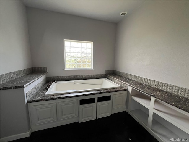 6100 Bluestem Unit 238, Frederick, CO 80530 - bathroom featuring a garden tub