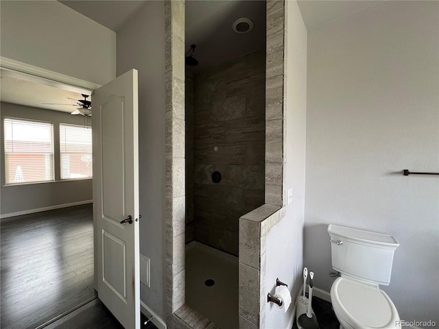 6100 Bluestem Unit 238, Frederick, CO 80530 - full bathroom featuring walk in shower, ceiling fan, and wood finished floors