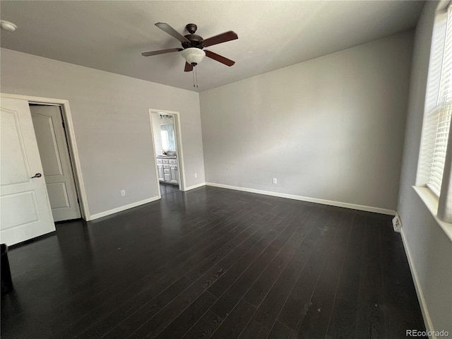6100 Bluestem Unit 238, Frederick, CO 80530 - empty room with ceiling fan, dark wood-style flooring, and plenty of natural light