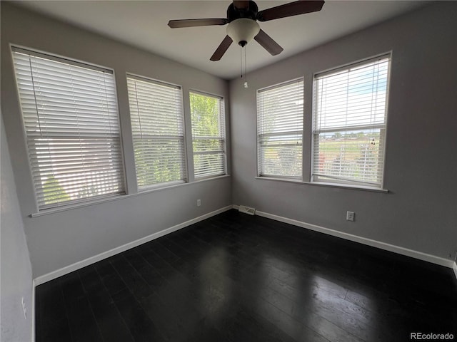 6100 Bluestem Unit 238, Frederick, CO 80530 - spare room featuring dark wood-type flooring and ceiling fan