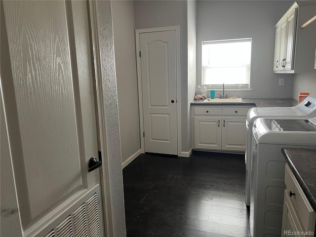 6100 Bluestem Unit 238, Frederick, CO 80530 - laundry area featuring cabinet space, separate washer and dryer, and dark wood-style flooring
