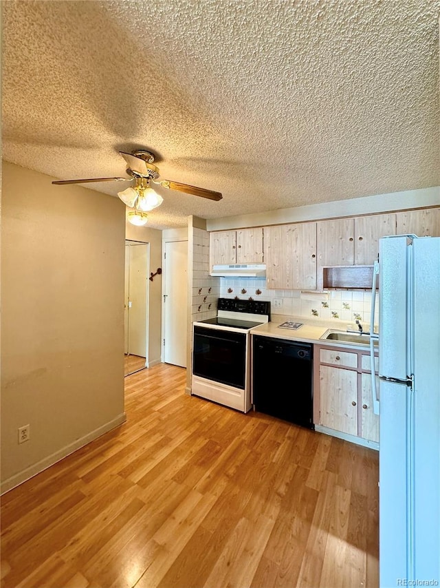 kitchen with light hardwood / wood-style floors, ceiling fan, white appliances, and a textured ceiling