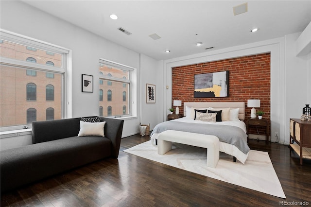 bedroom featuring dark wood-style flooring, visible vents, and recessed lighting
