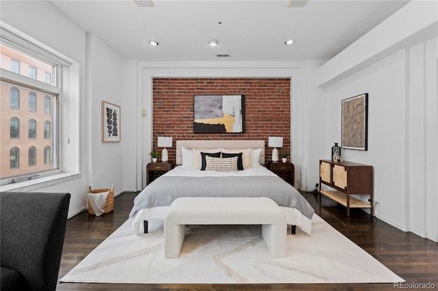 bedroom featuring baseboards, dark wood finished floors, visible vents, and recessed lighting