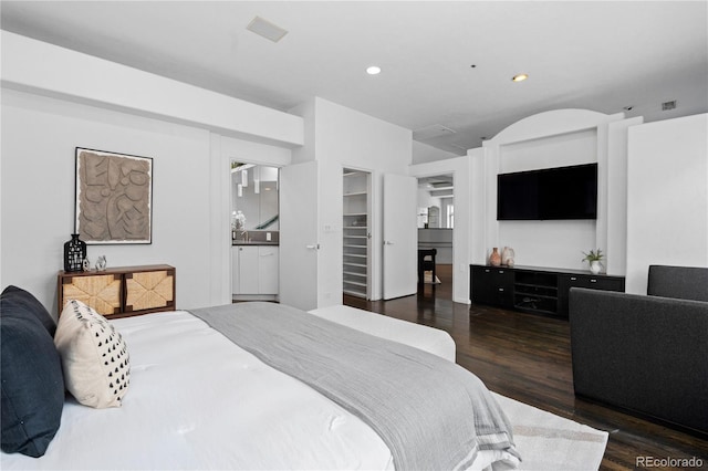 bedroom featuring recessed lighting and wood finished floors