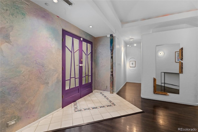 entrance foyer featuring recessed lighting, visible vents, baseboards, and wood finished floors