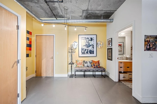 hallway with concrete floors