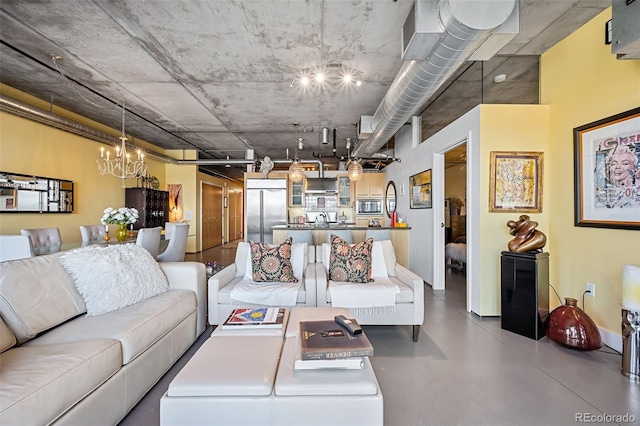 living room with an inviting chandelier