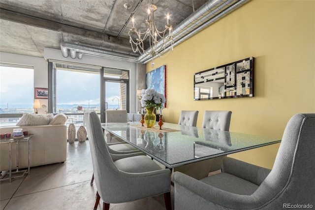 2100 16th St Unit 606, Denver, CO 80202 - dining area with concrete floors and an inviting chandelier