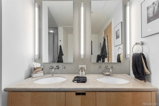 2100 16th St Unit 606, Denver, CO 80202 - full bathroom featuring double vanity and backsplash