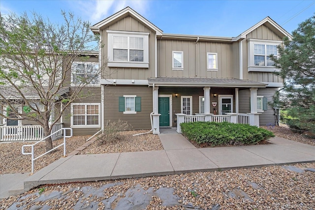 townhome / multi-family property featuring a porch