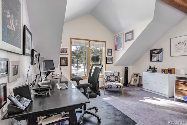 carpeted office with lofted ceiling