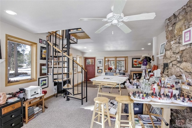 interior space with carpet floors and ceiling fan