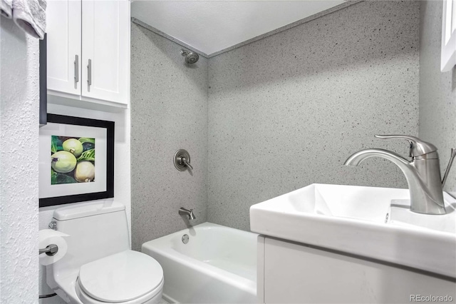 bathroom featuring vanity, shower / bathtub combination, and toilet