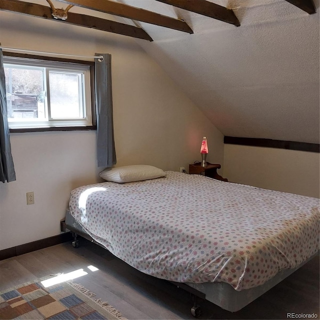 33 S Oak St, Alma, CO 80420 - bedroom with wood finished floors, vaulted ceiling, and a ceiling fan