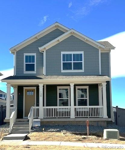 view of front of property with cooling unit and covered porch