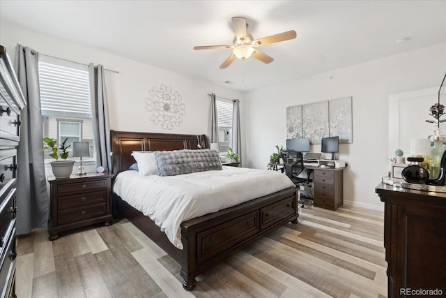 bedroom with baseboards, ceiling fan, and light wood finished floors