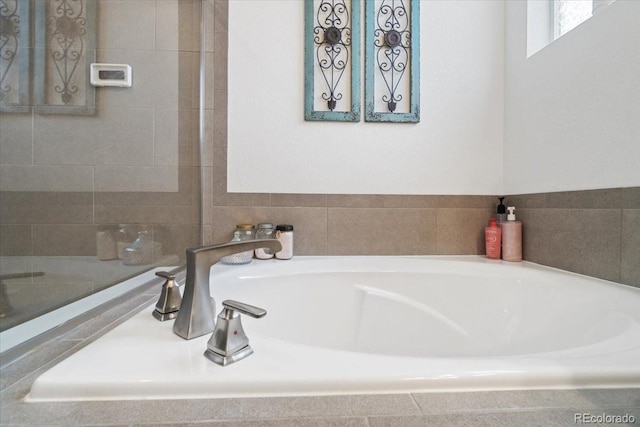 bathroom with a sink and a bath