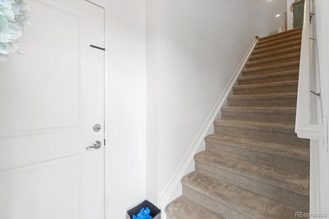 stairway with baseboards