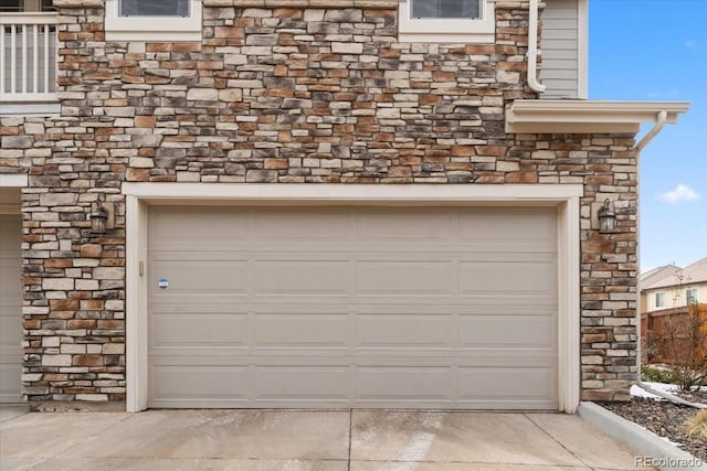 garage with concrete driveway