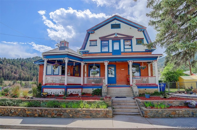 victorian-style house with covered porch